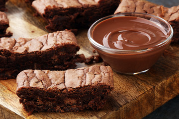 Brownie stack, chocolate cake on rustic wooden board