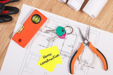 Home keys with electrical diagrams and accessories for engineering jobs, building home concept