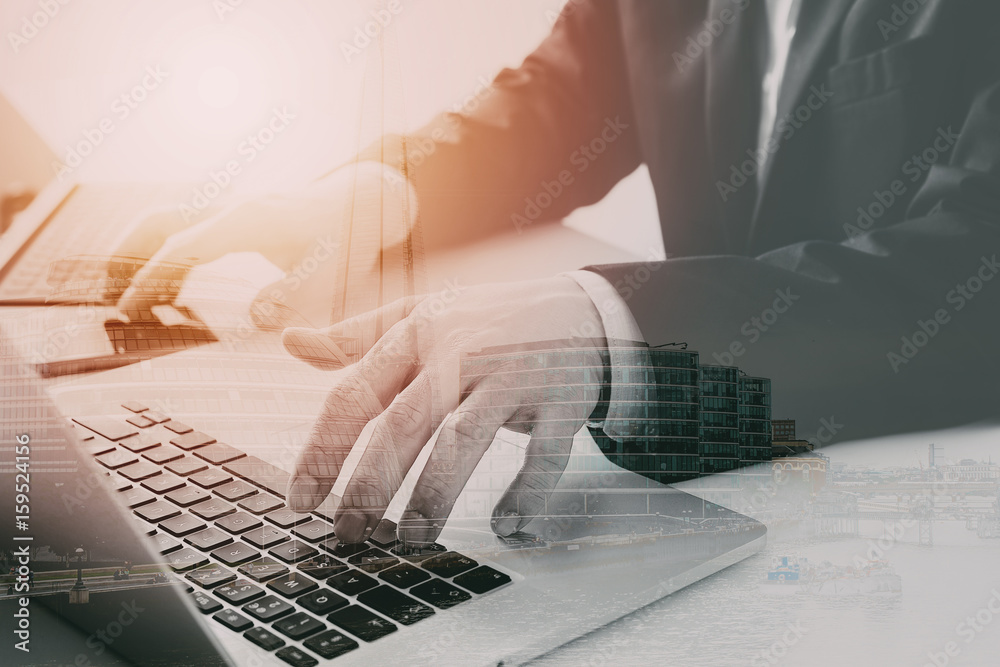 Poster hands of businessman typing on laptop in modern office with smart phone and digital tablet computer