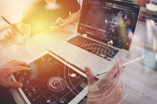 co working team meeting concept,businessman using mobile phone and digital tablet and laptop computer in modern office with virtual icon diagram