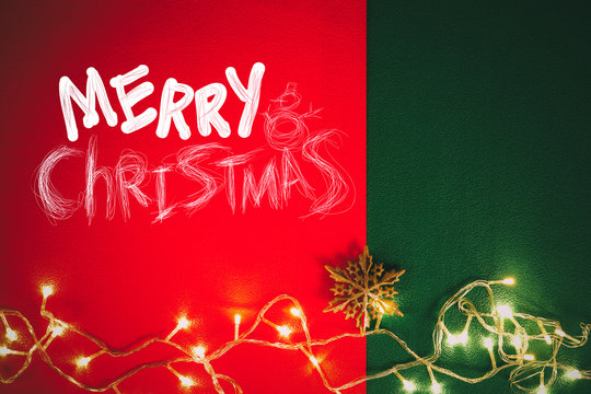 Greeting Season concept.Christmas light and pine star on red and green background