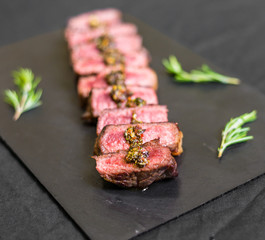 New york strip porterhouse steak meat against black background
