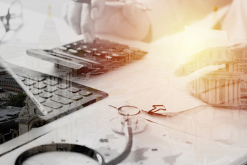 Healthcare costs and fees concept.Hand of smart doctor used a calculator for medical costs in modern hospital