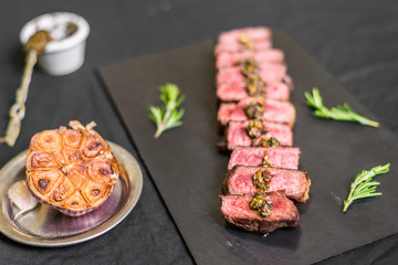 New york strip porterhouse steak meat against black background