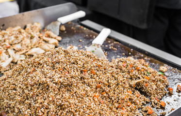 Bulgur durum wheat with vegetables and soy sauce at a street food market