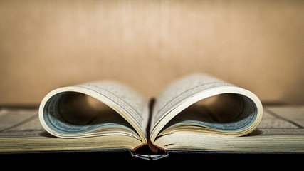 book with heart shaped folded paper with blurred background
