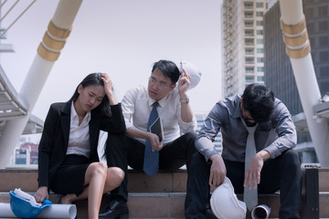 Fototapeta premium Asian businessman and woman engineer architect professional group failed or upset project plan or job their career for working business problem concept
