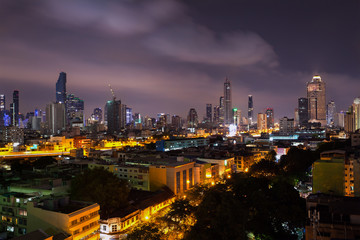 Obraz premium business cityscape area and modern building city and transportation urban area at dusk twilight night sky of bangkok thailand