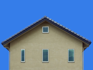 gray house wall gable asian style roof and clear blue sky