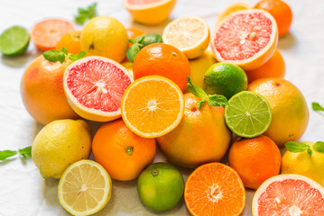 A large assortment of colorful citrus fruit (lemon, lime, orange, grapefruit, mandarin, tangerine,...