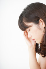 Fototapeta premium Young woman suffering from a headache