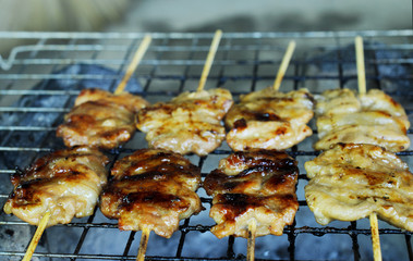 Close up of Grilled pork or Mooping Thai local food cooking on a coal