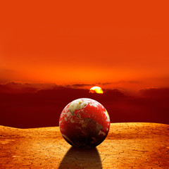 surreal global warming concept of globe on dried land