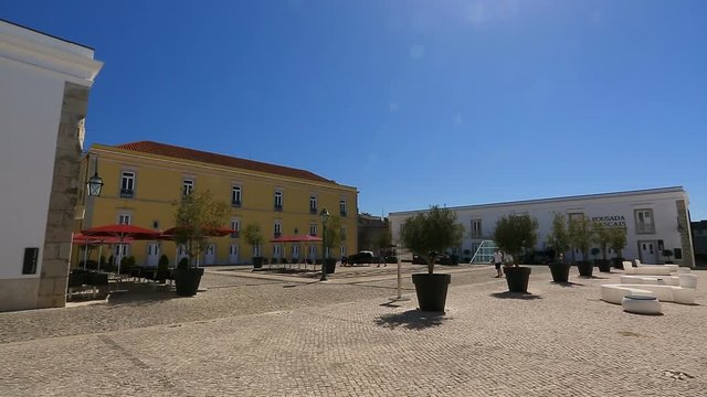 Half-empty square with buildings around in Cascais Citadel in Portugal, sequence