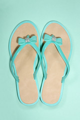 Women's summer sandals on a green background
 