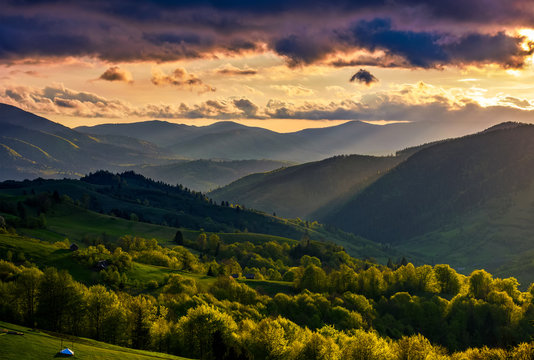 mountain rural area in springtime at cloudy sunset
