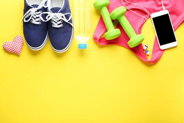 Fitness equipment on yellow background