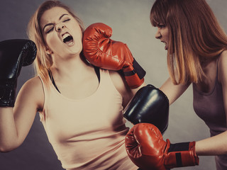Two agressive women having boxing fight