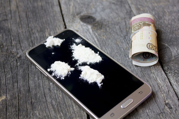 heroin on the phone. associated money with the rubber band.