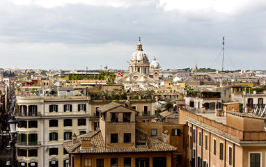 Obraz premium Rome, Italy - April 18, 2017: view of people and Piazza di Spagna from piazza della Trinita dei Monti. Piazza di Spagna is one of the most famous squares, it owes its name to the Palazzo di Spagna
