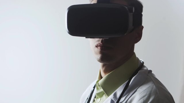 Doctor uses a virtual reality glasses.