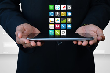 Man showing  the  app icons in digital tablet