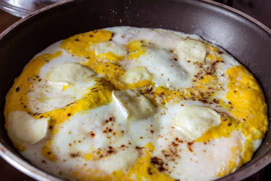 Egg omelet with cheese in the pan.