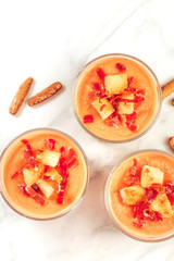 Salmorejo served in glasses with breadsticks, place for text