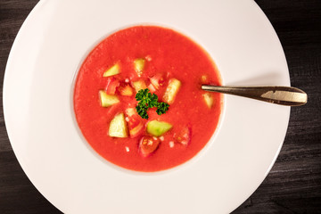 Photo of a plate of gazpacho soup with copy space