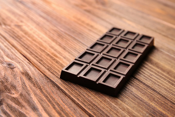 Chocolate bar on wooden table