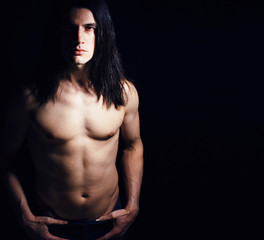handsome young man with long hair naked torso