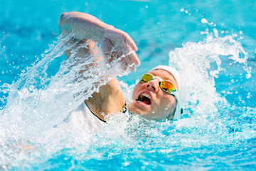 Female swimmer on training in the swimming pool