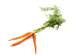 Fresh carrot with leaves on white background