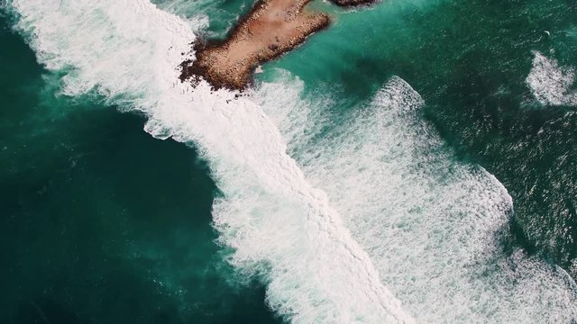 View from Above. Aerial Tropical Blue Background. Tropical Crashed Waves. Crystal clean Sea Water. Aerial shot. Crashed Waves near Tropical Beach. Panoramic Aerial View. Beautiful Pier, Beach Bay View