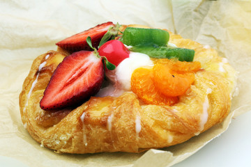danish pastry with strawberry, kiwi and tangarine