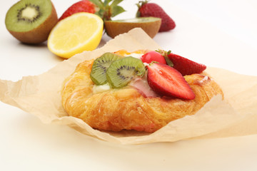 danish pastry with strawberry, kiwi and tangarine