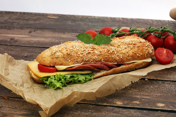 Delicious salami cheese and ham baguettes with fresh lettuce