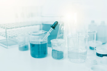 scientist hand holding laboratory test tube, science laboratory research and development concept