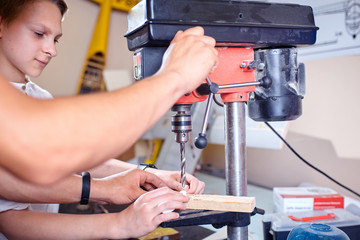 Child in the workshop working tool