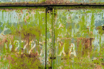 Rusty old green painted texture background. Green grunge metallic background. Metal texture with scratches and cracks, free space