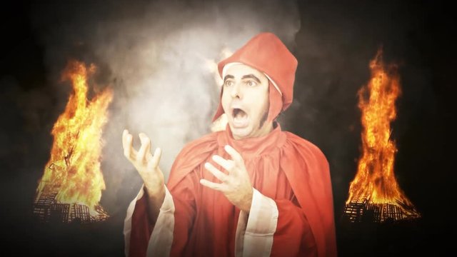 A man in Hell with burning fire and smoke clouds: Dante Alighieri, the 13th century Italian Poet (a dressed up actor). He frightens and retreats.
