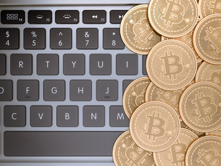 Golden Bitcoins On laptop. Trading Concept Of Crypto Currency