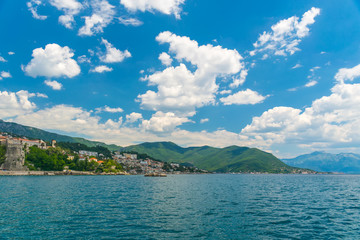 Obraz premium A sea yacht arrives to the city of Herceg Novi in Montenegro along the Adriatic Sea.