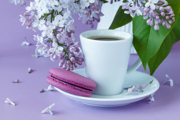 porcelain cup with coffee and lilac
