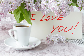 porcelain cup with coffee and lilac