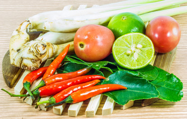 Various vegetables and seasoning cooking ingredients Tom Yum Soup or River Prawn Spicy Sour Soup (Tom Yum Goong) on  wooden background,Healthy eating and diet food concept.