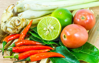 Various vegetables and seasoning cooking ingredients Tom Yum Soup or River Prawn Spicy Sour Soup (Tom Yum Goong) on  wooden background,Healthy eating and diet food concept.