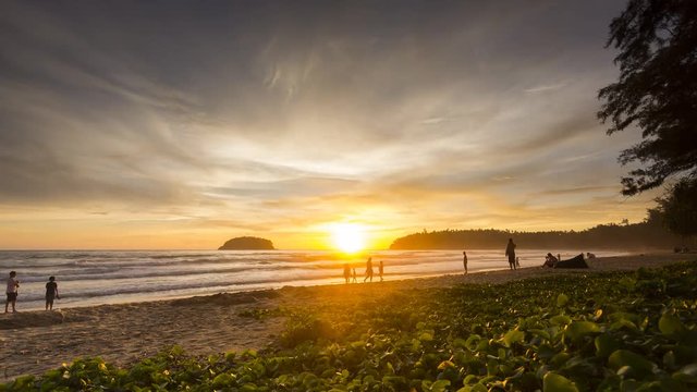 Time - lapse Activities on the beach with colorful sunset  at sunset time , Phuket Thailand.