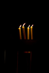 4 Candle in black background