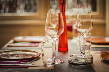 Wine glass in a restaurant closeup, warm and elegant